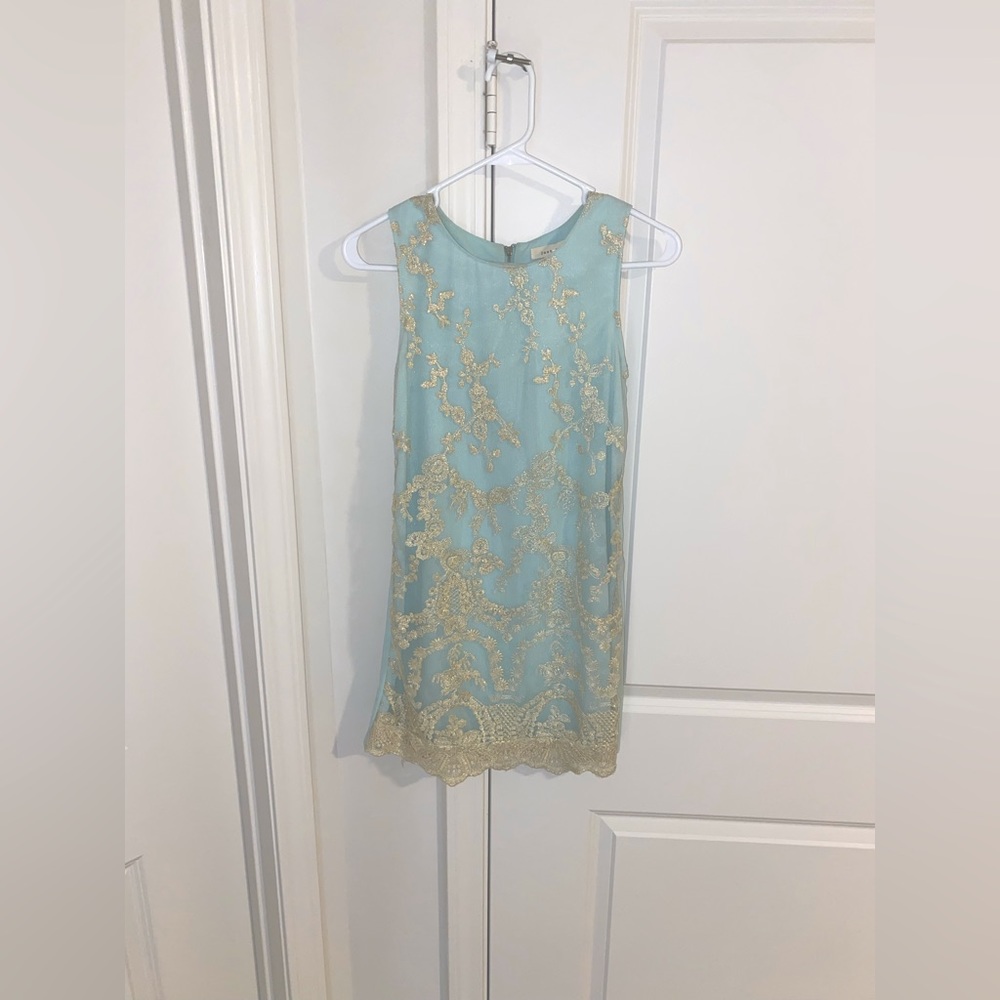 mint green mini dress with a tulle overlay and gold embroidered 
Size small
